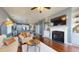Open-concept living room featuring a fireplace and hardwood floors at 11 Balboa Pkwy, Clayton, NC 27520