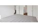 Spacious bedroom featuring plush carpeting and easy access to the en suite bathroom and walk-in closet at 112 Oat Grain Ct, Clayton, NC 27520