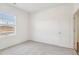 Bedroom features neutral carpet, white walls, a bright window and closet at 112 Oat Grain Ct, Clayton, NC 27520
