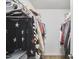 Well-organized walk-in closet with ample hanging space and shelving for a tidy and practical storage solution at 1120 N Roxboro St, Durham, NC 27701