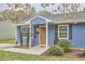 Charming blue home with a well-maintained lawn and manicured landscaping at 1120 N Roxboro St, Durham, NC 27701