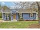 Charming blue home with a well-maintained lawn and manicured landscaping at 1120 N Roxboro St, Durham, NC 27701