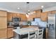 Modern kitchen with stainless steel appliances, light wood cabinets, and a granite island perfect for food preparation at 1120 N Roxboro St, Durham, NC 27701