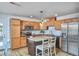 Bright kitchen featuring stainless steel appliances, light wood cabinets, and a granite island perfect for meal prep at 1120 N Roxboro St, Durham, NC 27701