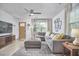 Spacious living room featuring a plush sectional sofa, elegant decor, and abundant natural light for comfortable living at 1120 N Roxboro St, Durham, NC 27701