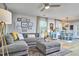 Cozy living room flows into the dining area, featuring a comfortable sectional, stylish decor, and natural light at 1120 N Roxboro St, Durham, NC 27701