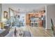 Open-concept living space with hardwood floors, stainless steel appliances, and ample natural light at 1120 N Roxboro St, Durham, NC 27701