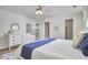 Comfortable bedroom with a ceiling fan, ensuite bathroom, and walk-in closet at 1120 N Roxboro St, Durham, NC 27701