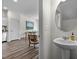 Stylish powder room featuring a pedestal sink and modern fixtures at 1120 Tofino Dr, Durham, NC 27704