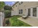 Back yard with a well-maintained lawn and patio, providing an inviting outdoor space for relaxation and entertainment at 11251 Lofty Heights Pl, Raleigh, NC 27614