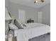 Cozy bedroom featuring neutral walls, carpet, and a comfortable bed with a ceiling fan at 11251 Lofty Heights Pl, Raleigh, NC 27614