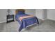 Comfortable bedroom with soft carpeting, a cozy bed, and neutral decor at 11251 Lofty Heights Pl, Raleigh, NC 27614