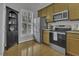 Well-lit kitchen with stainless steel appliances and ample cabinet space at 11251 Lofty Heights Pl, Raleigh, NC 27614