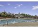 Serene pool view showcasing a clubhouse, slide, and inviting swimming area, perfect for recreation and relaxation at 11251 Lofty Heights Pl, Raleigh, NC 27614