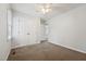 This carpeted bedroom features a closet with double doors and bright paint on the walls at 114 Marshay Meadow Rd, Youngsville, NC 27596