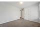 Neutral bedroom featuring plush carpet, baseboard trim, and a bright neutral wall paint at 114 Marshay Meadow Rd, Youngsville, NC 27596