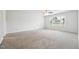 Bright and open bedroom with a ceiling fan, large window, and neutral carpet at 114 Marshay Meadow Rd, Youngsville, NC 27596