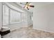 Cozy dining area featuring a bay window, ceiling fan, and tile flooring at 114 Marshay Meadow Rd, Youngsville, NC 27596