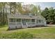 Charming single-story home with a welcoming front porch, shutters, and a well-maintained yard at 114 Marshay Meadow Rd, Youngsville, NC 27596