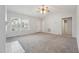 Bright and airy living room with a fireplace, neutral carpet, and plenty of space at 114 Marshay Meadow Rd, Youngsville, NC 27596