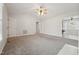 Spacious and inviting living room with plush carpet, a ceiling fan, and ample natural light at 114 Marshay Meadow Rd, Youngsville, NC 27596