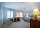 Inviting bedroom boasts a four-poster bed, a desk, and a chair with floral accents at 114 Montrose Dr # 114, Durham, NC 27707