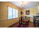 Dining area with natural light, decorative chandelier, and views of the kitchen at 114 Montrose Dr # 114, Durham, NC 27707