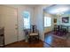 Cozy dining area with hardwood floors and chandelier, adjacent to doorway at 114 Montrose Dr # 114, Durham, NC 27707
