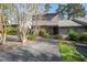 Inviting home with brick and siding, mature landscaping, and a paved driveway at 114 Montrose Dr # 114, Durham, NC 27707