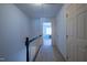 Bright hallway leads to rooms filled with natural light, showcasing a carpeted floor at 114 Montrose Dr # 114, Durham, NC 27707