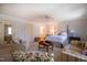 Bright main bedroom with neutral tones, sitting area, and access to an ensuite bathroom at 114 Montrose Dr # 114, Durham, NC 27707