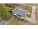 Aerial shot of the property showcasing the house, yard, driveway and surrounding neighborhood at 116 Lakewood Dr, Wendell, NC 27591
