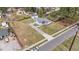 Aerial view showcasing the property's layout, including a long driveway and surrounding landscape, and neighborhood at 116 Lakewood Dr, Wendell, NC 27591