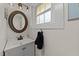 Bathroom with vanity, mirror, and decorative window at 116 Lakewood Dr, Wendell, NC 27591