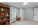 Bedroom features a bookshelf, window, and light green walls at 116 Lakewood Dr, Wendell, NC 27591