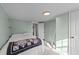 Bedroom featuring light green walls, carpeted floors, and white wood plank ceilings at 116 Lakewood Dr, Wendell, NC 27591