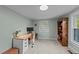 Bedroom features a desk, white wood plank ceilings, and light green walls at 116 Lakewood Dr, Wendell, NC 27591