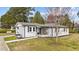 Well-kept home with a charming front porch and landscaped front yard at 116 Lakewood Dr, Wendell, NC 27591
