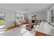 Cozy living room features a fireplace, hardwood floors, and plenty of natural light at 116 Lakewood Dr, Wendell, NC 27591