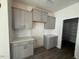 Bright kitchen featuring shaker cabinets, light countertops, modern backsplash, and stainless appliances at 118 Fairwinds Drive Dr, Lillington, NC 27546