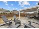 Inviting backyard featuring a paver patio, fire pit, grill, and pergola, perfect for outdoor entertaining at 1207 Bluewater Way, Durham, NC 27703