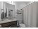 Granite vanity bathroom featuring a shower with curtain, offering a clean and functional space at 1207 Bluewater Way, Durham, NC 27703