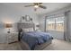 Relaxing bedroom with a large window, ceiling fan, and soft colors create a peaceful retreat at 1207 Bluewater Way, Durham, NC 27703