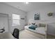 Bright bedroom with a cozy daybed and desk, complemented by tasteful decor and natural light at 1207 Bluewater Way, Durham, NC 27703