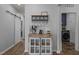 Stylish coffee bar area with decorative shelving, coffee maker, and convenient access to laundry room at 1207 Bluewater Way, Durham, NC 27703