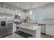Modern kitchen featuring stainless steel appliances, granite countertops, and white cabinets at 1207 Bluewater Way, Durham, NC 27703