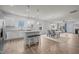 Spacious open-concept layout with kitchen island, dining area, and living room at 1207 Bluewater Way, Durham, NC 27703