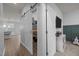 Convenient walk-in pantry with sliding barn door provides ample storage off the kitchen at 1207 Bluewater Way, Durham, NC 27703