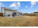 Perfect outdoor living area with a white pergola, grill, and comfortable seating at 1207 Bluewater Way, Durham, NC 27703
