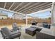 The patio is perfect for outdoor dining with a grill and cozy seating arrangement at 1207 Bluewater Way, Durham, NC 27703